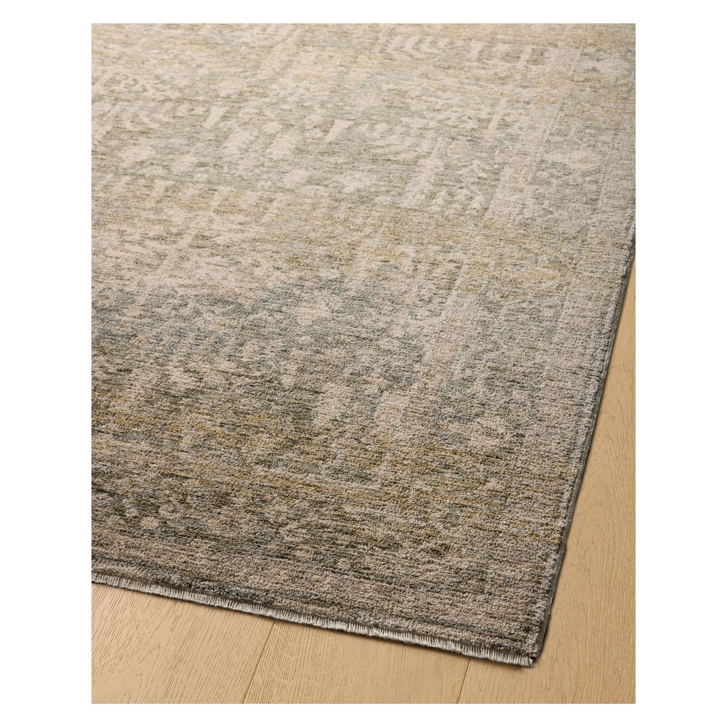 Junie Moss Natural Rug corner shown from a certain viewing angle