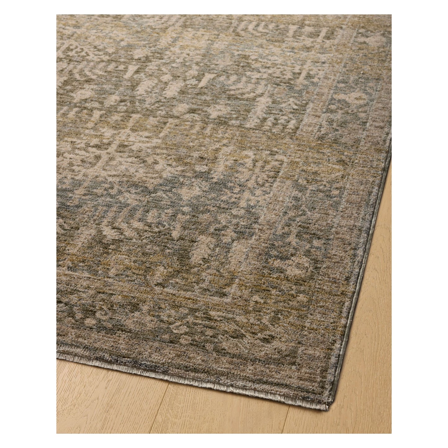 Junie Moss Natural Rug corner shown from a certain viewing angle