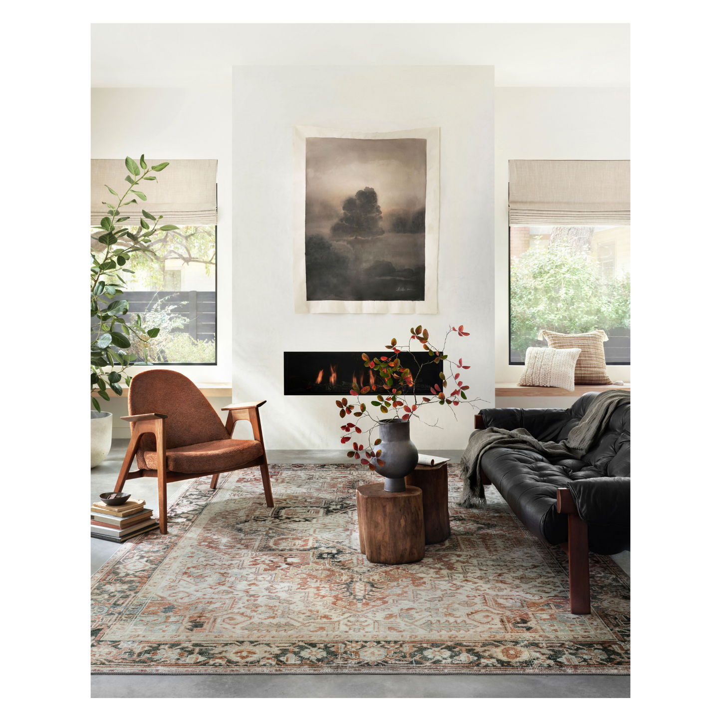 Lenna Rust Charcoal Rug shown in bright and airy living room