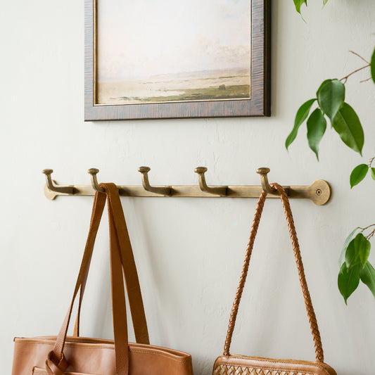 Hammered Iron Wall Hooks with purses hanging from hooks