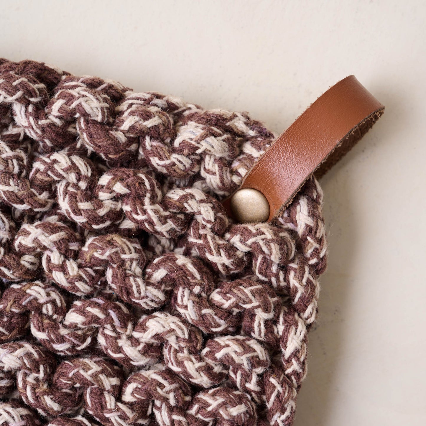 Heathered Hand Crocheted Pot Holder close up of leather handle on brown pot holder