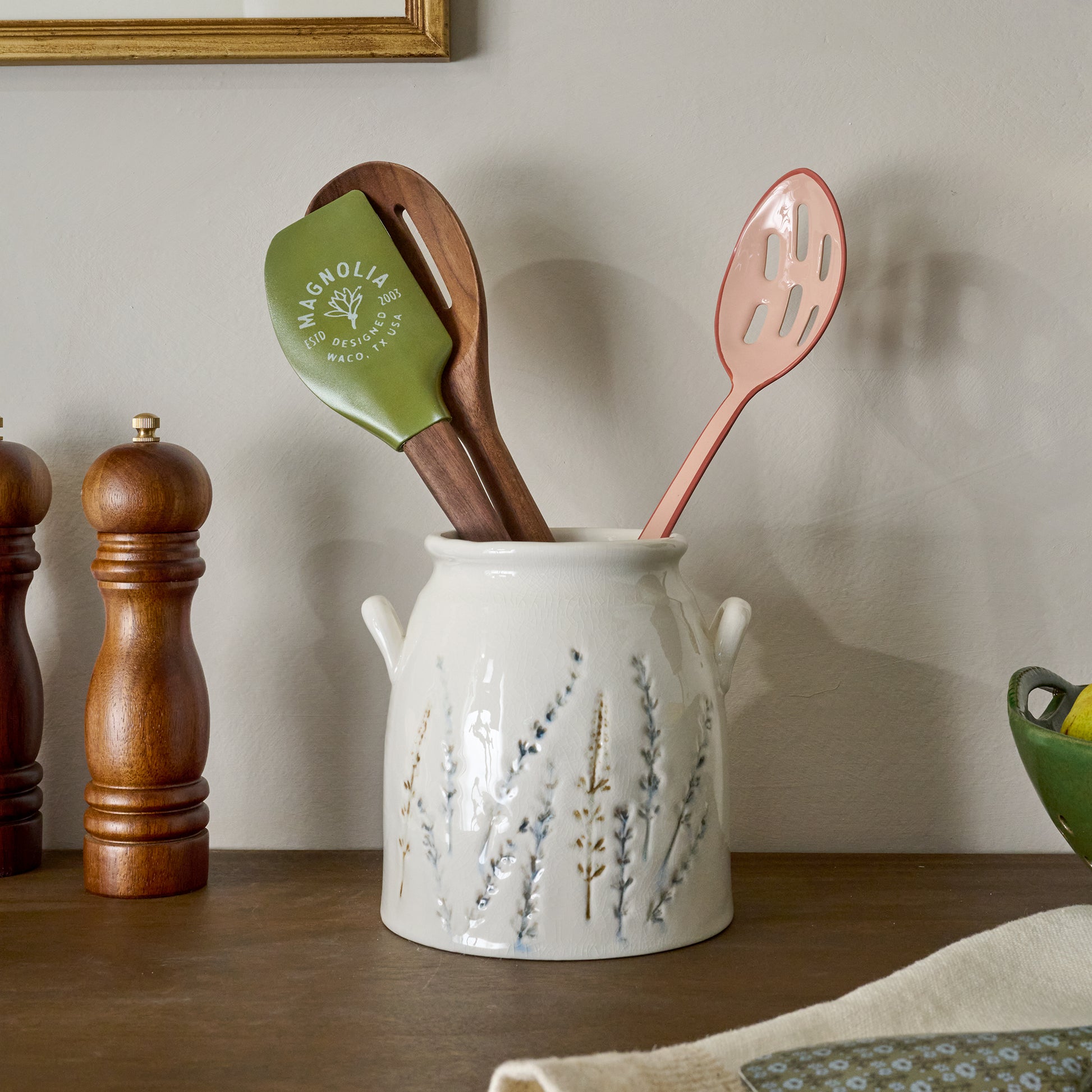 Pressed Floral Utensil Crock shown on countertop with utensils