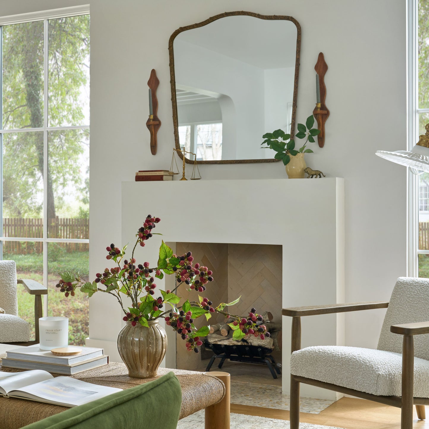 Laurel Metal Framed Mirror shown in living room