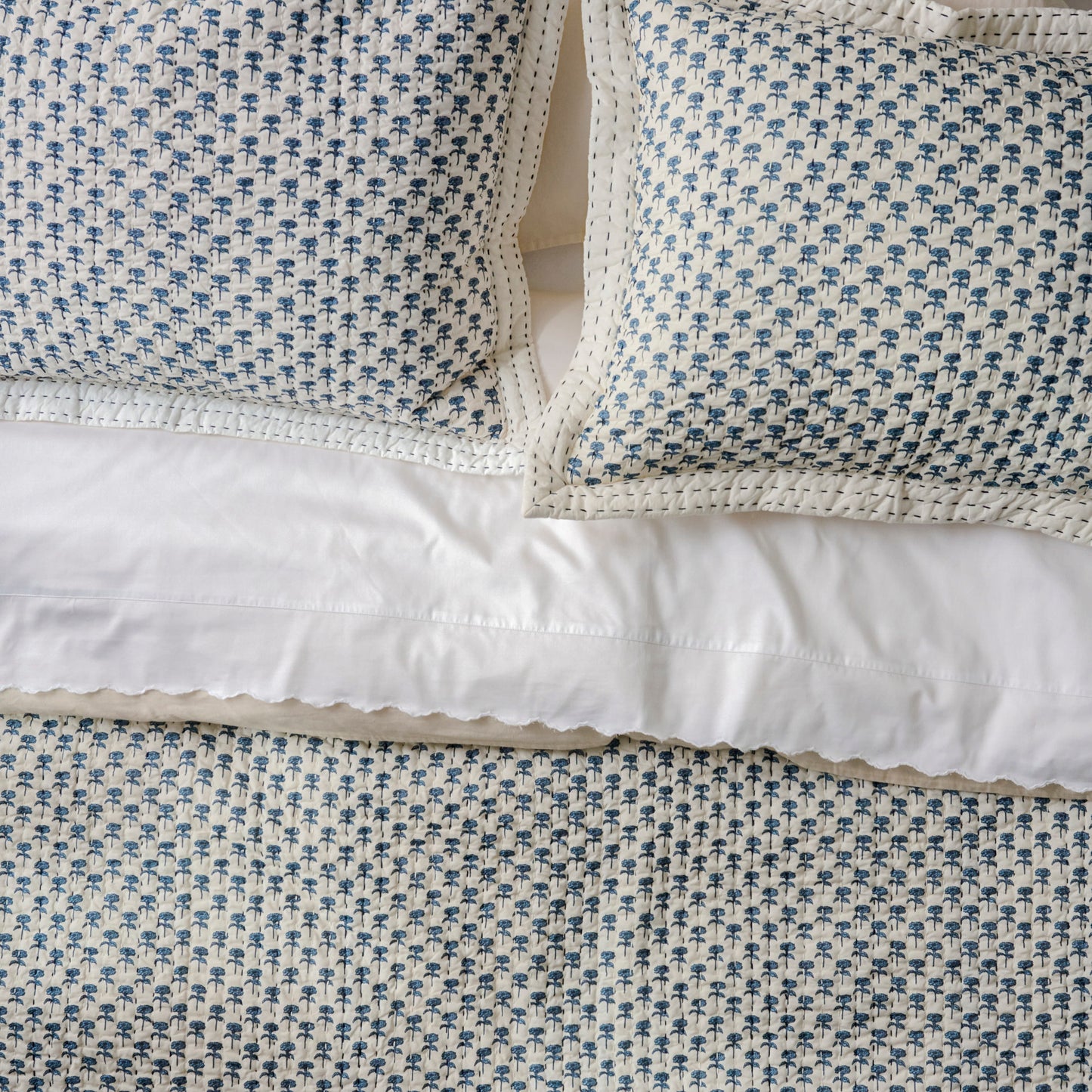 Lilianne Floral Printed Quilt shown on bed with quilt