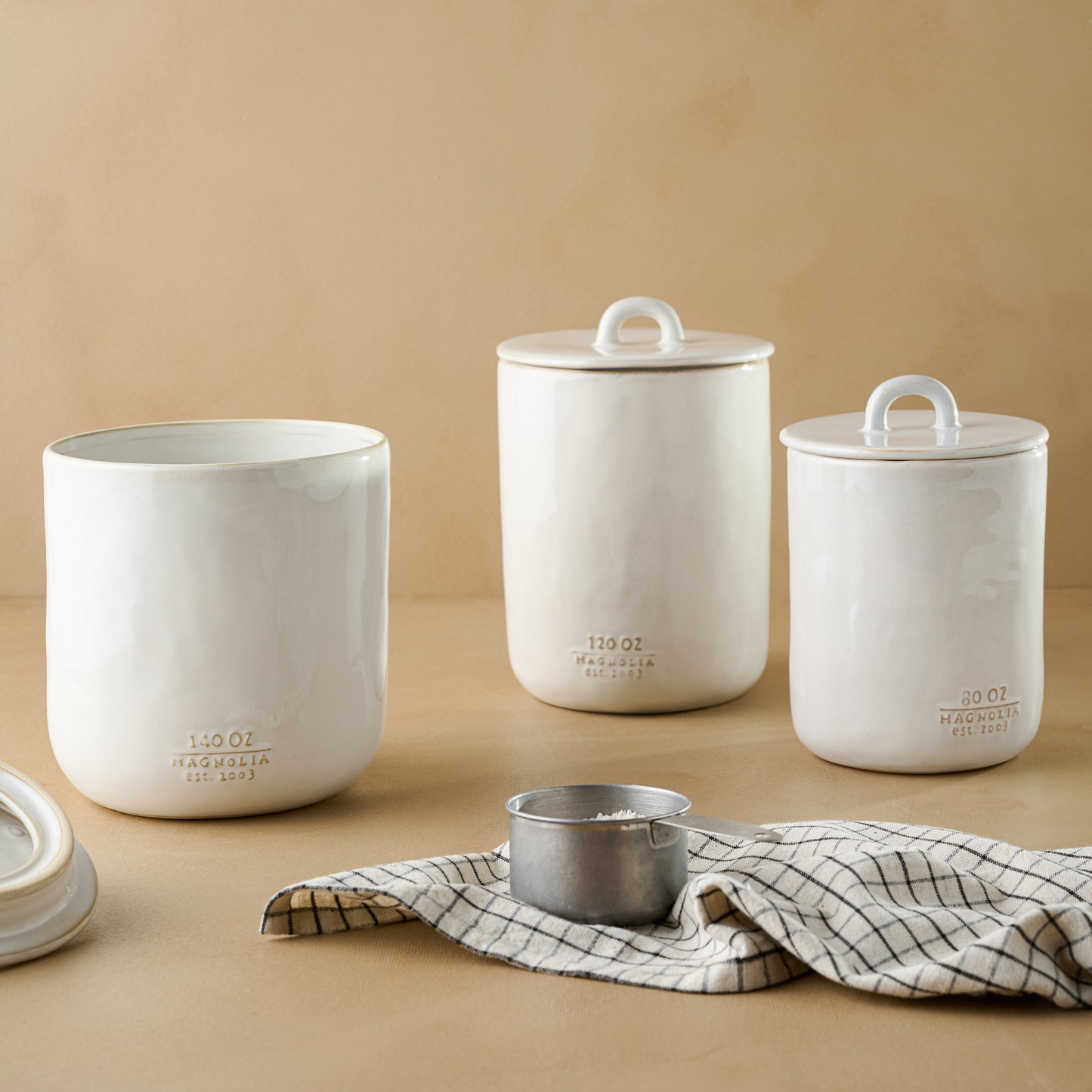 Mia Ceramic Canisters with a checkered tea towel