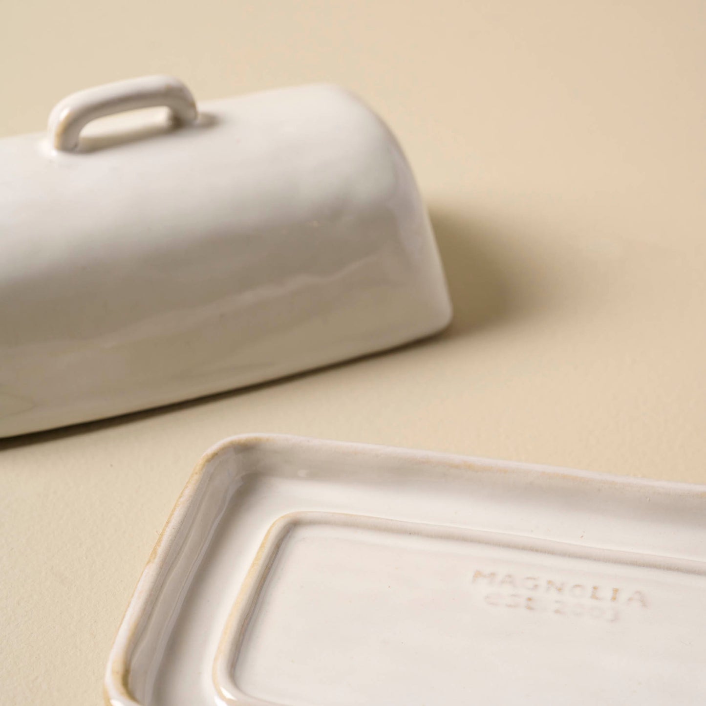 Magnolia Est. Ceramic Butter Dish with lid off to the side