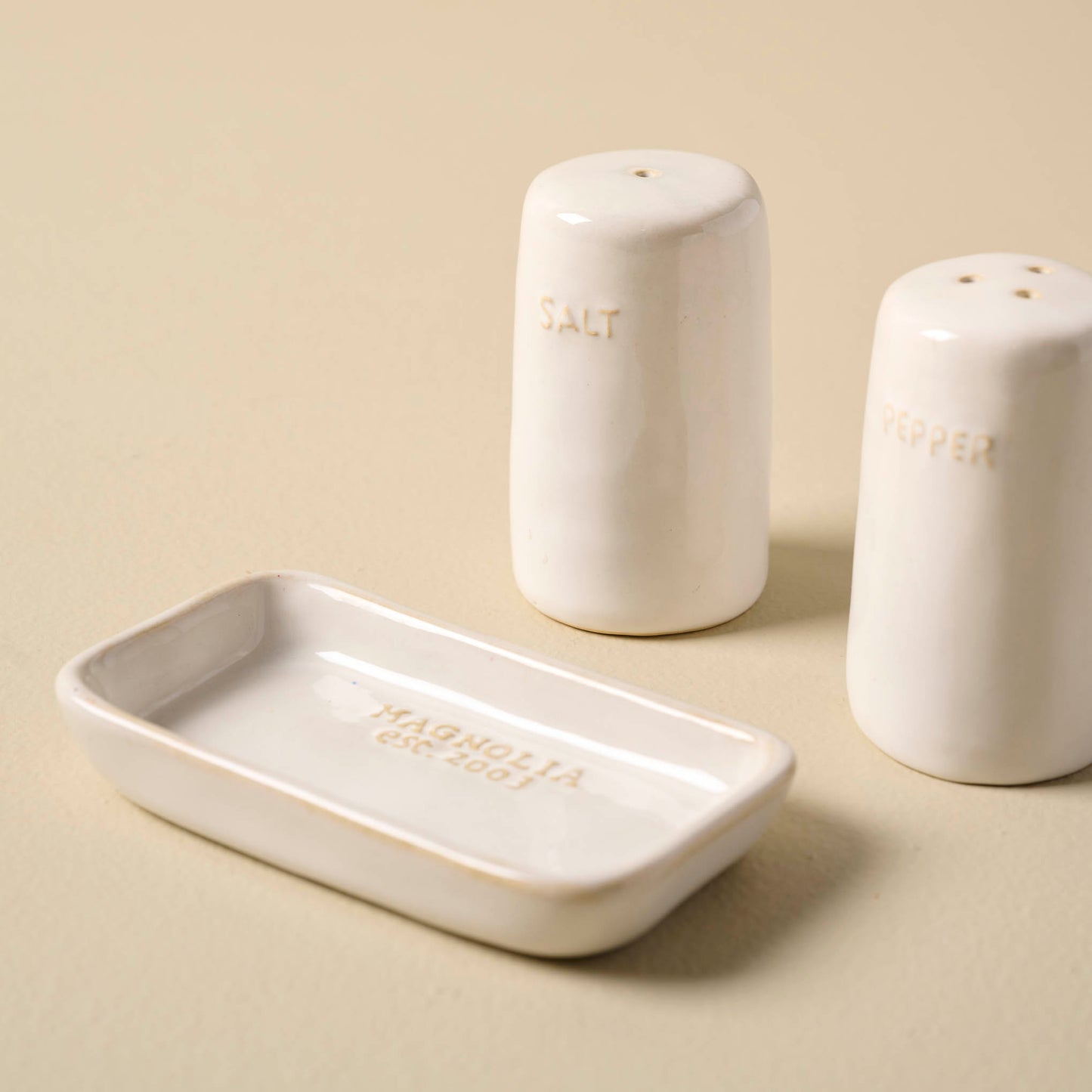Magnolia Est. Salt and Pepper Shakers off of the included dish
