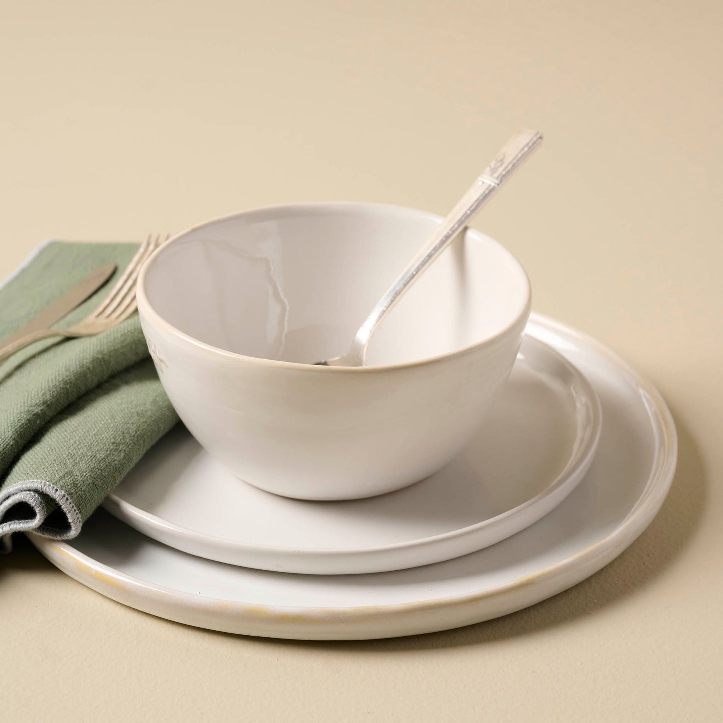 Magnolia Est. Plates and cereal bowl stacked