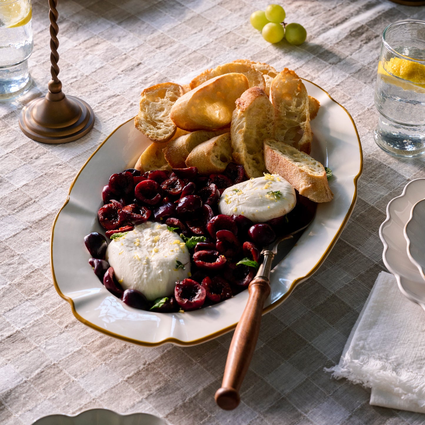 Luna Scalloped Serving Platter with food on top
