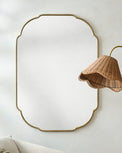 Antique Brass Luna Mirror shown hung on wall