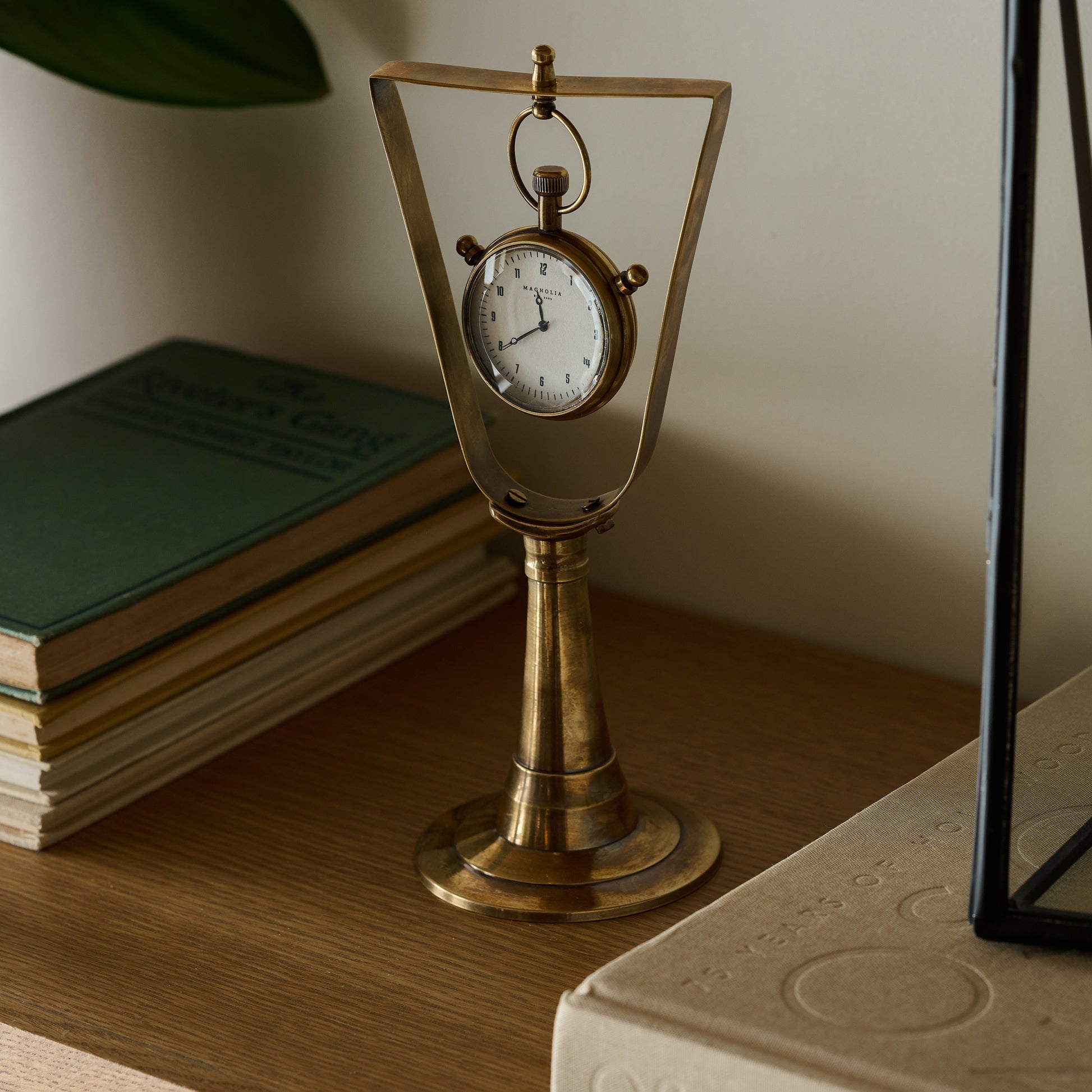 Antique Inspired Hanging Table Clock on a shelf