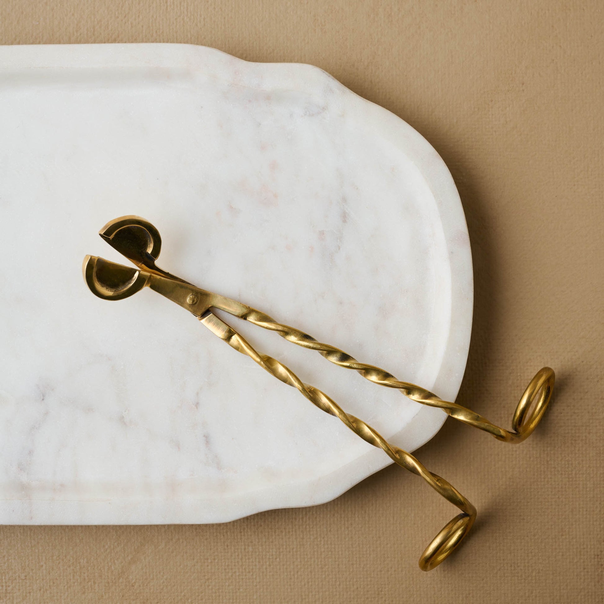 Brigitte Marble Tray close up with wax trimmer on top