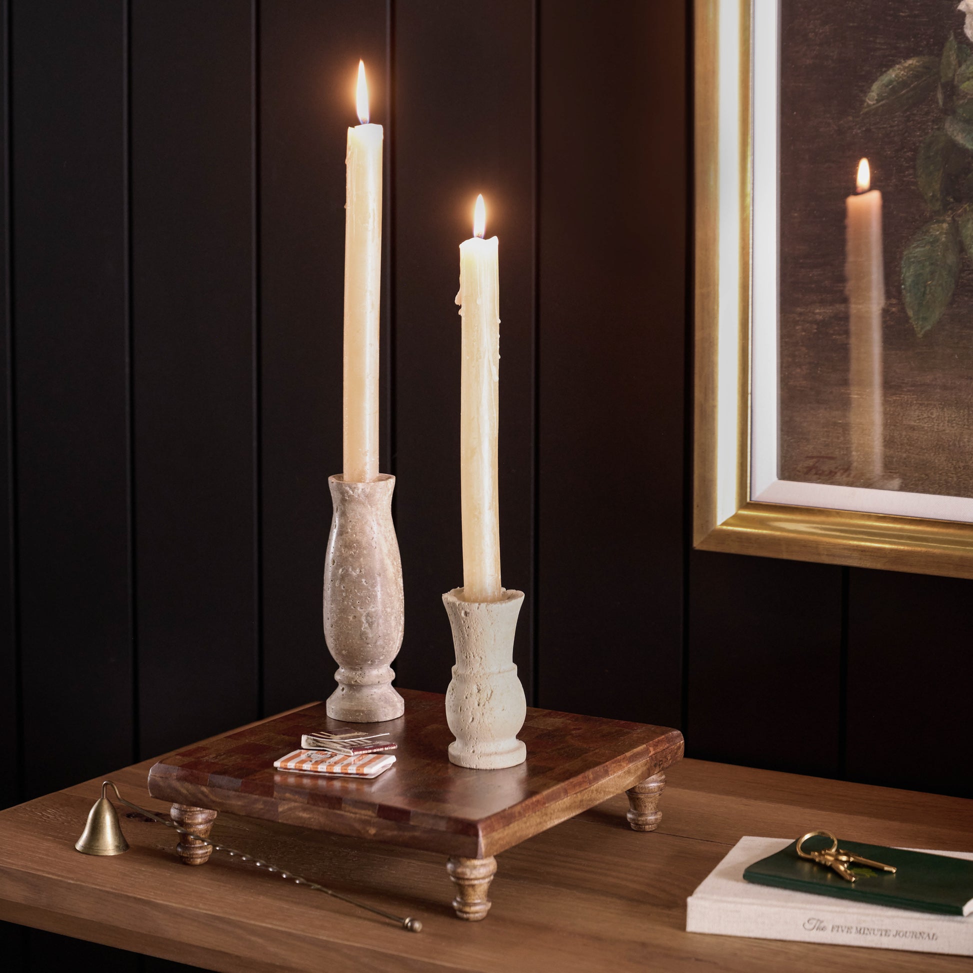Checkered Wood Riser on a dresser with taper holders on top and candle sticks