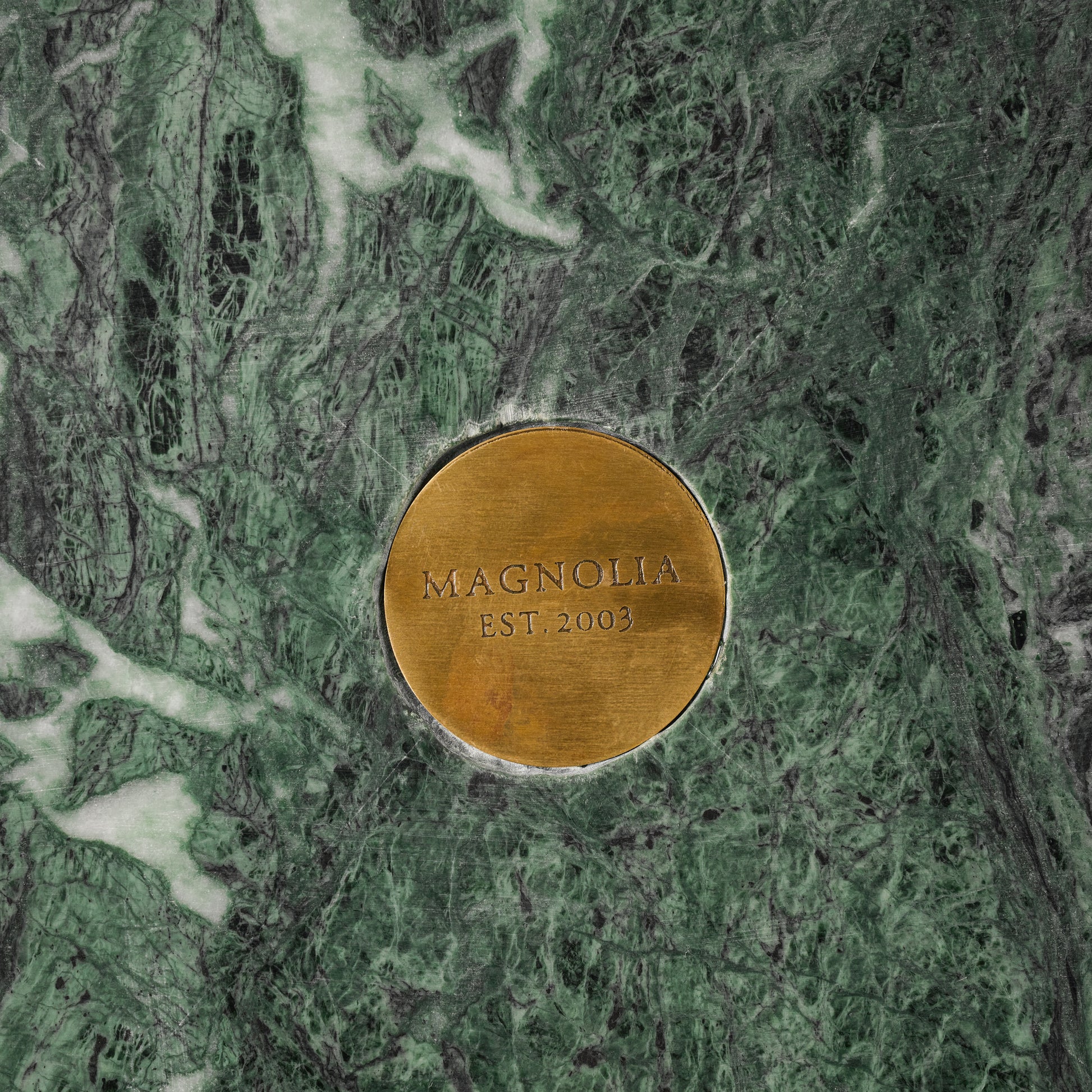 Green and White Marble Checkers Set close up of magnolia logo on bottom of checkers set