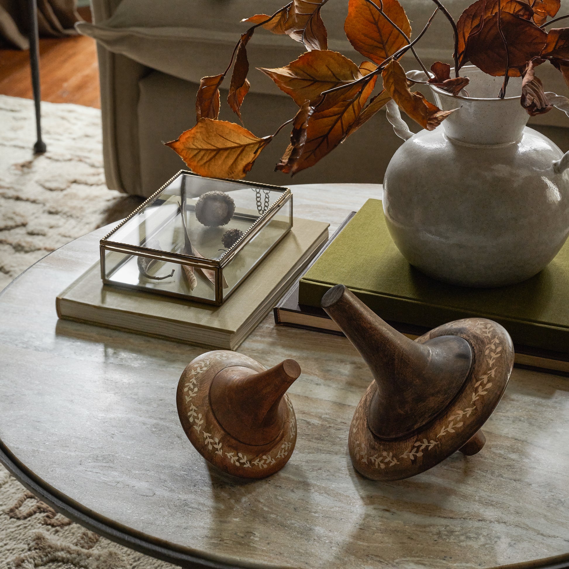 Small and Large Etched Wood Spinners shown on coffee table