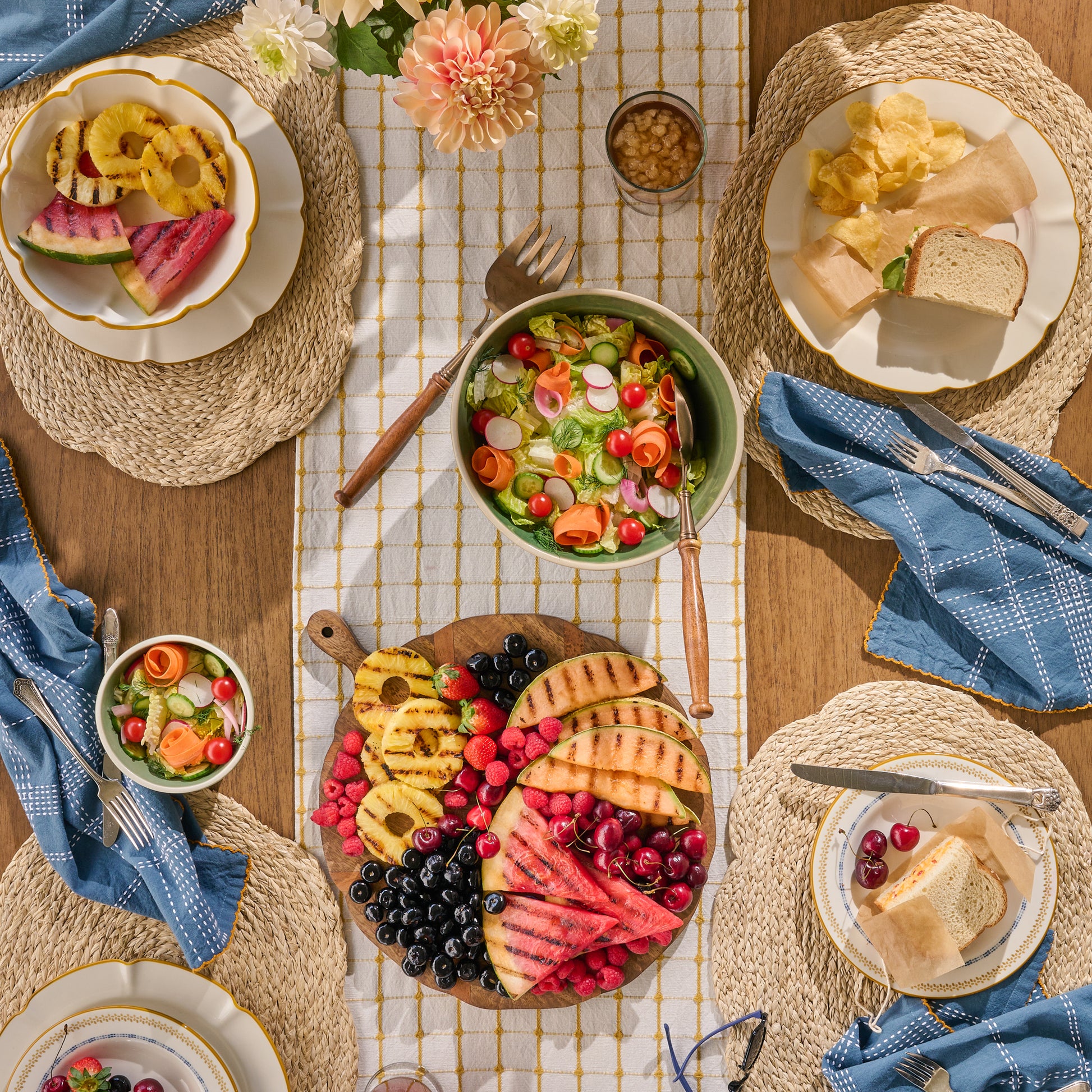 Antiqued Wood Round Serving Board with fruit on top of a table