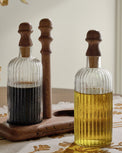 Antiqued Wood Ribbed Glass Oil & Vinegar Set shown up close on table