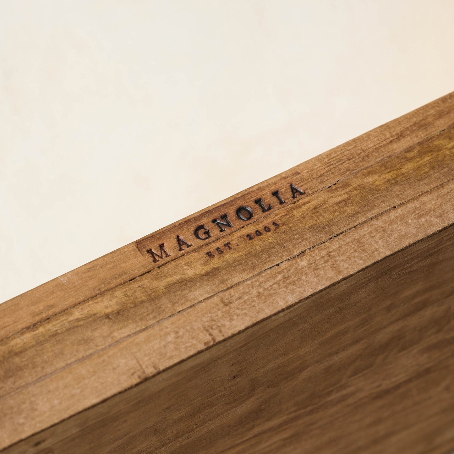 Griffin Hand Carved Wood Shelf magnolia logo branded onto the wood