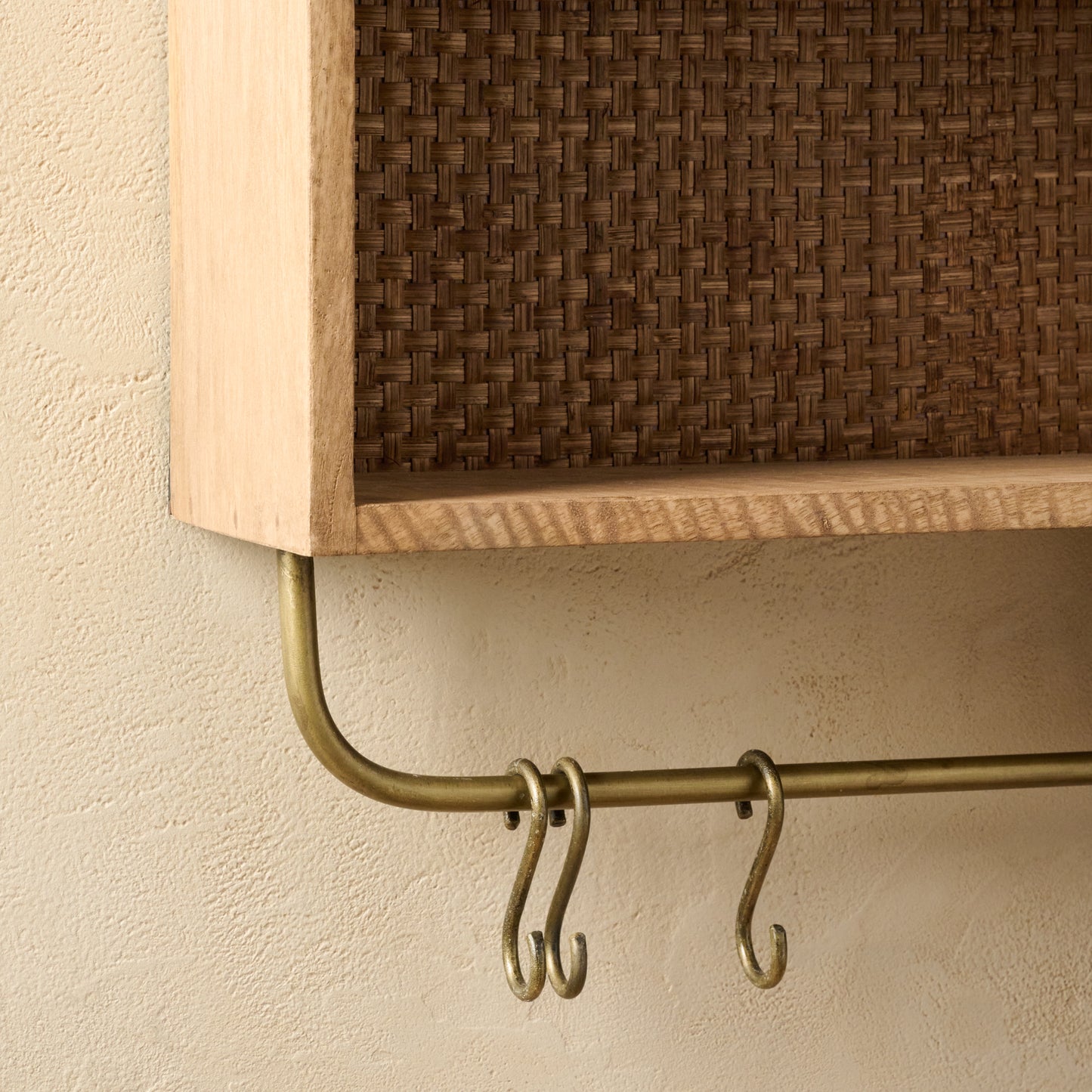 Belmar Arched Woven Wall Shelf close up of hooks on bottom of shelf