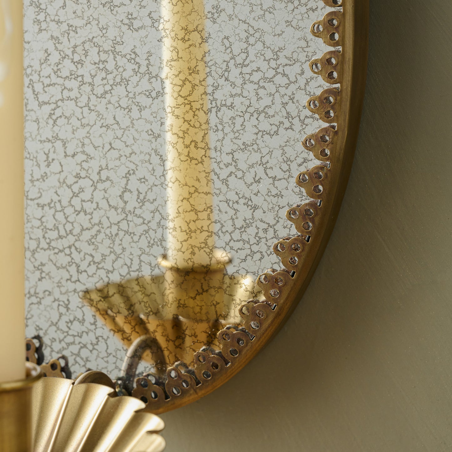 Oval Antique Mirrored Sconce close up of mirror