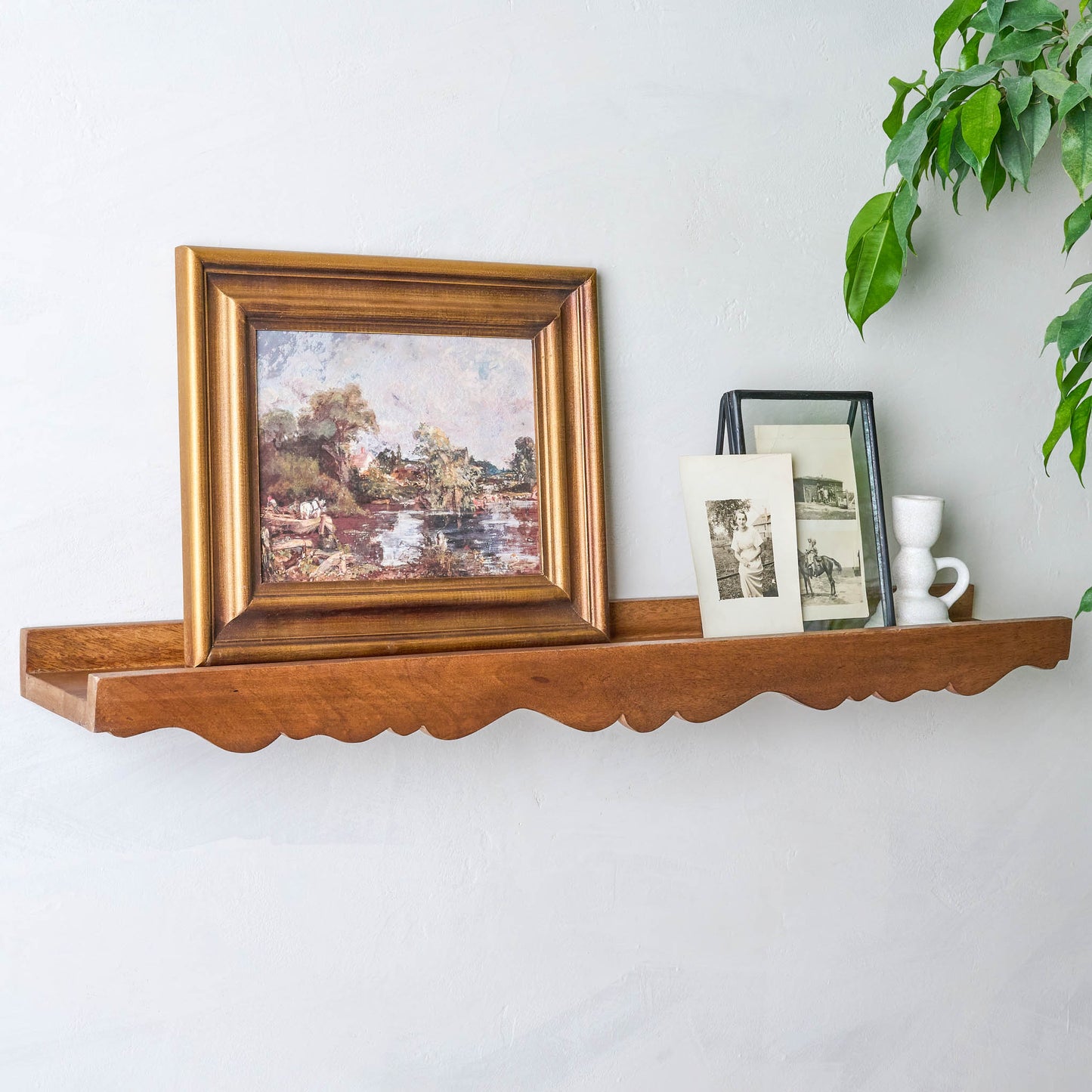 Daphne Wood Scalloped Picture Ledge with pictures on top