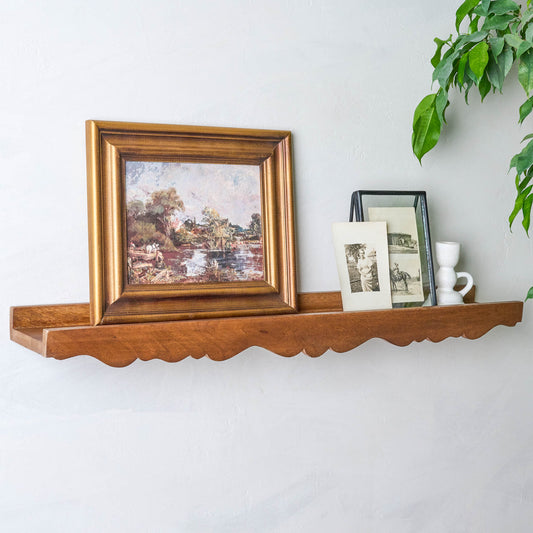 Daphne Wood Scalloped Picture Ledge with pictures on top