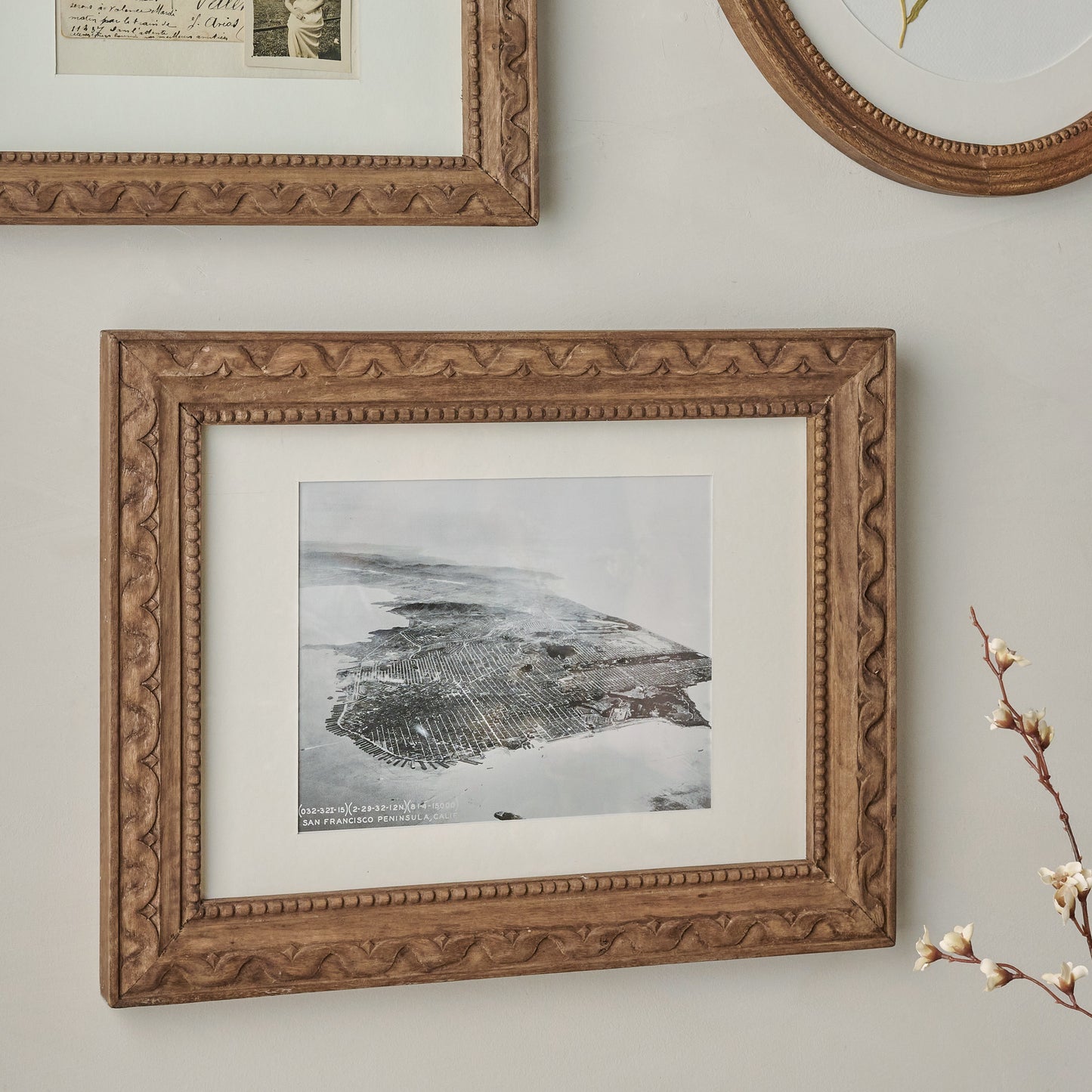 8"x10" Willa Antiqued Wood Wall Frame with Matte shown on wall