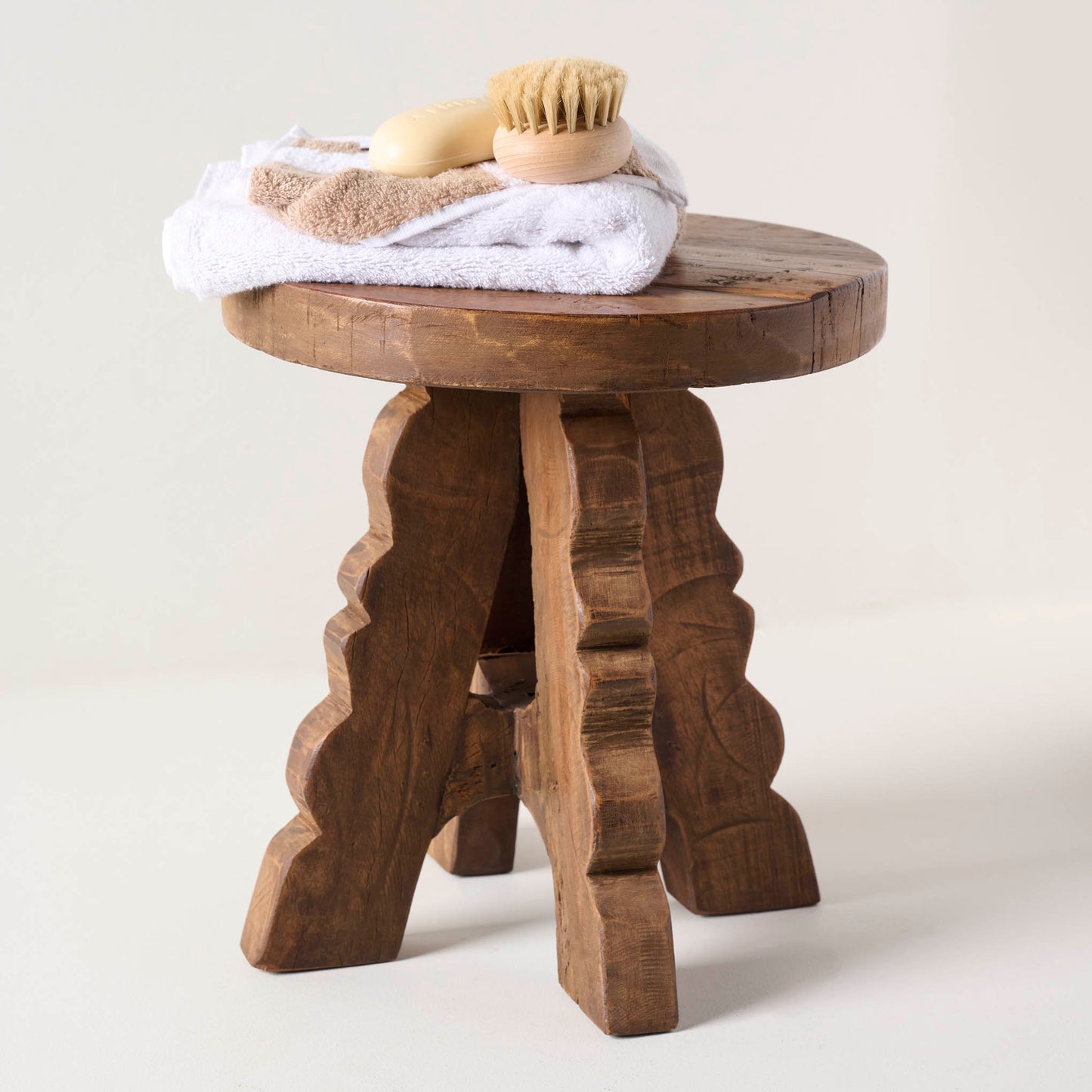 Reclaimed Wood Stool shown holding bathroom accessories