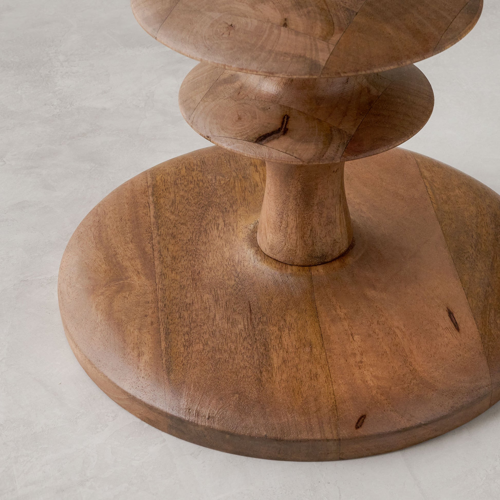 Enzo Turned Wood Side Table in color honey Mango close up of base of table