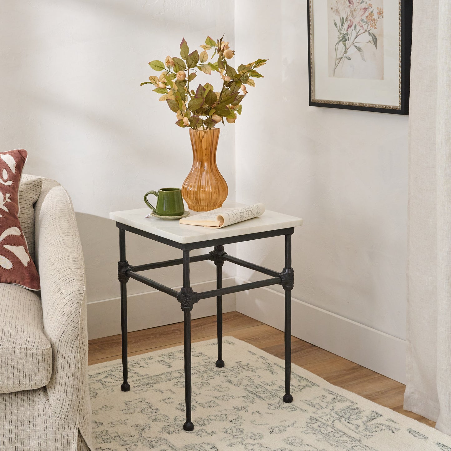 Ansel End Table shown next to upholstered chair