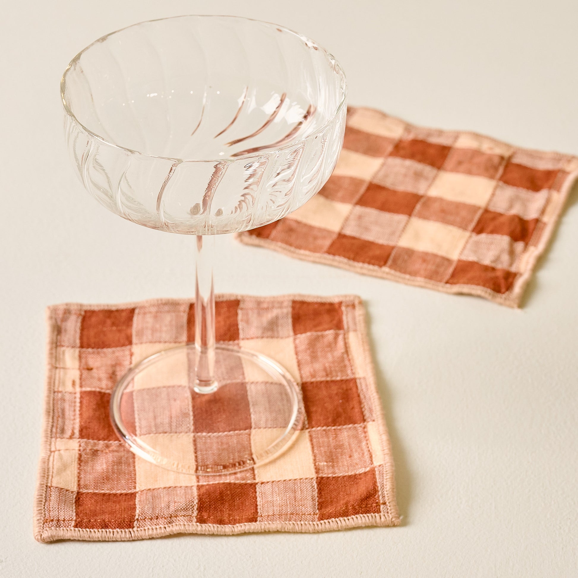 Brown/Coral Gingham Cocktail Napkins Set of Four with fluted coupe glass