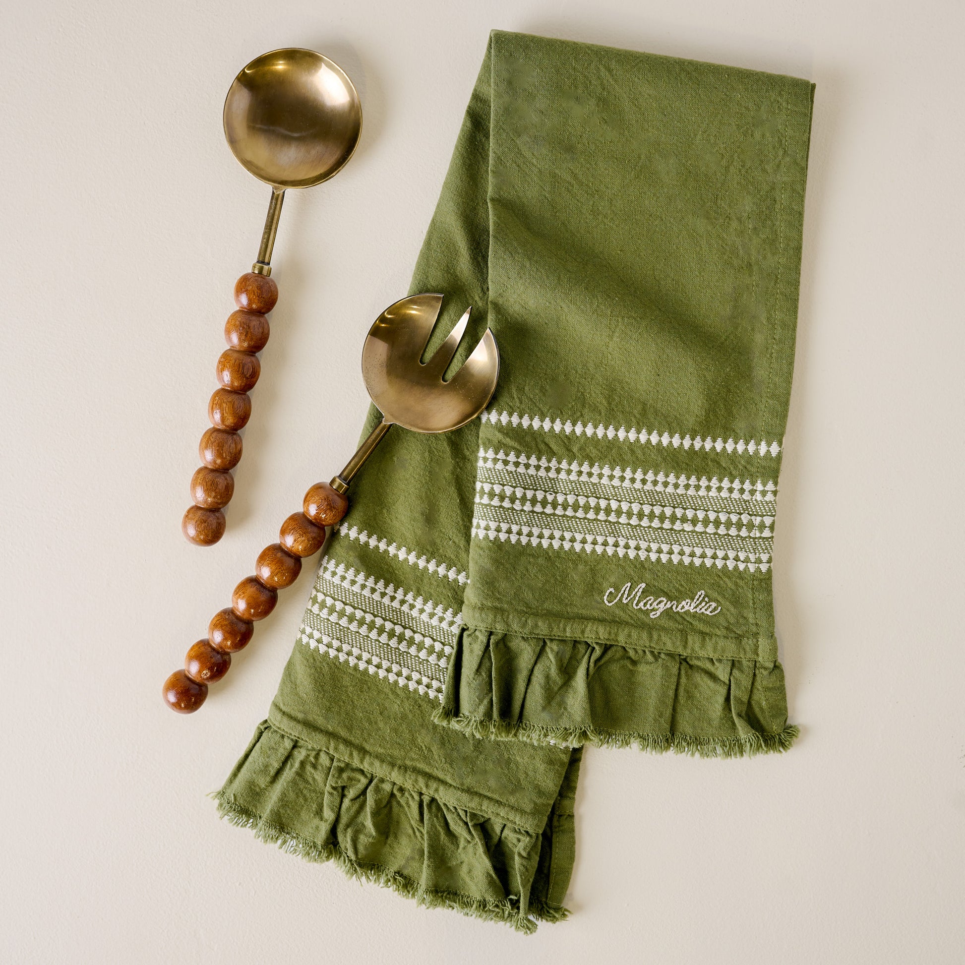 Antique Brass and Beaded Wood Serving Set shown with napkin