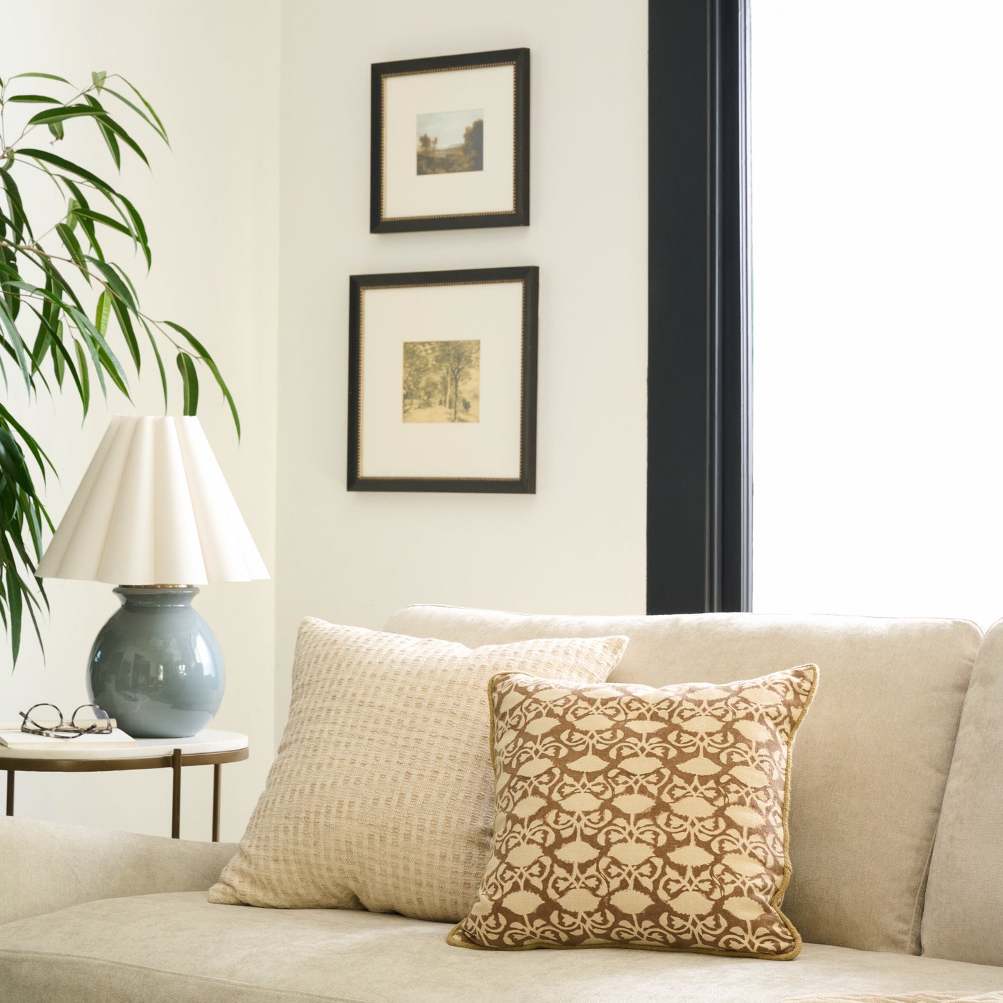 Pivoine Fleurs Pillow on a sofa