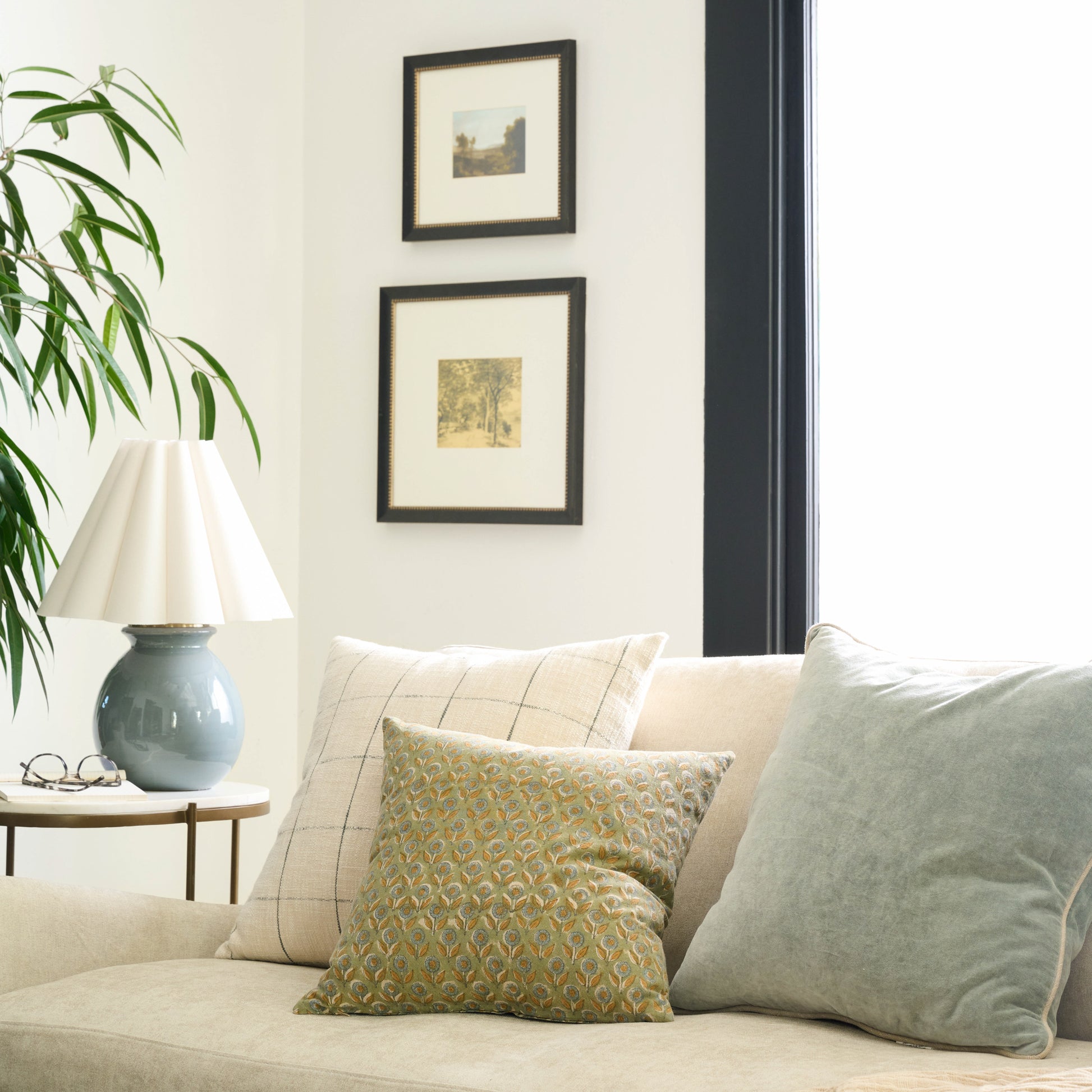 Claire Floral Printed Pillow on a sofa