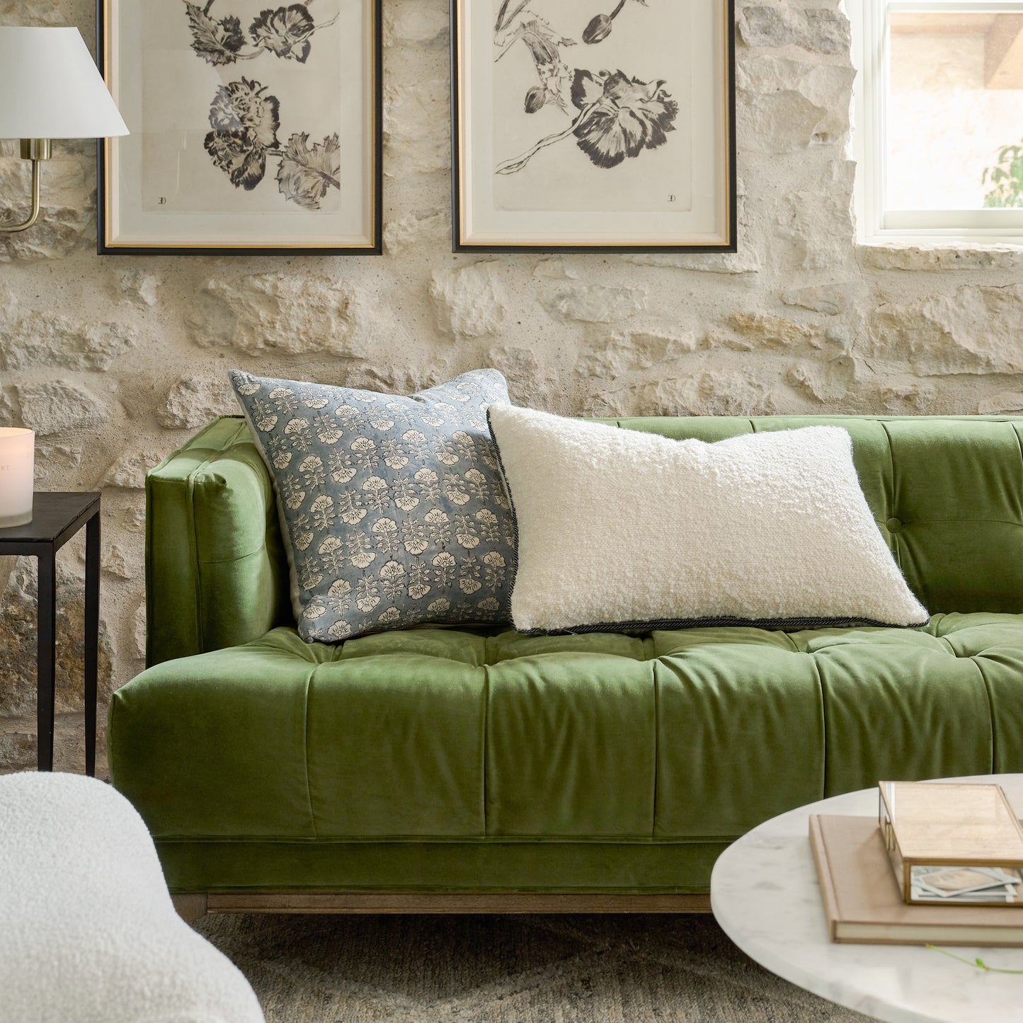 Flora Silver Blue Printed Pillow on a green sofa