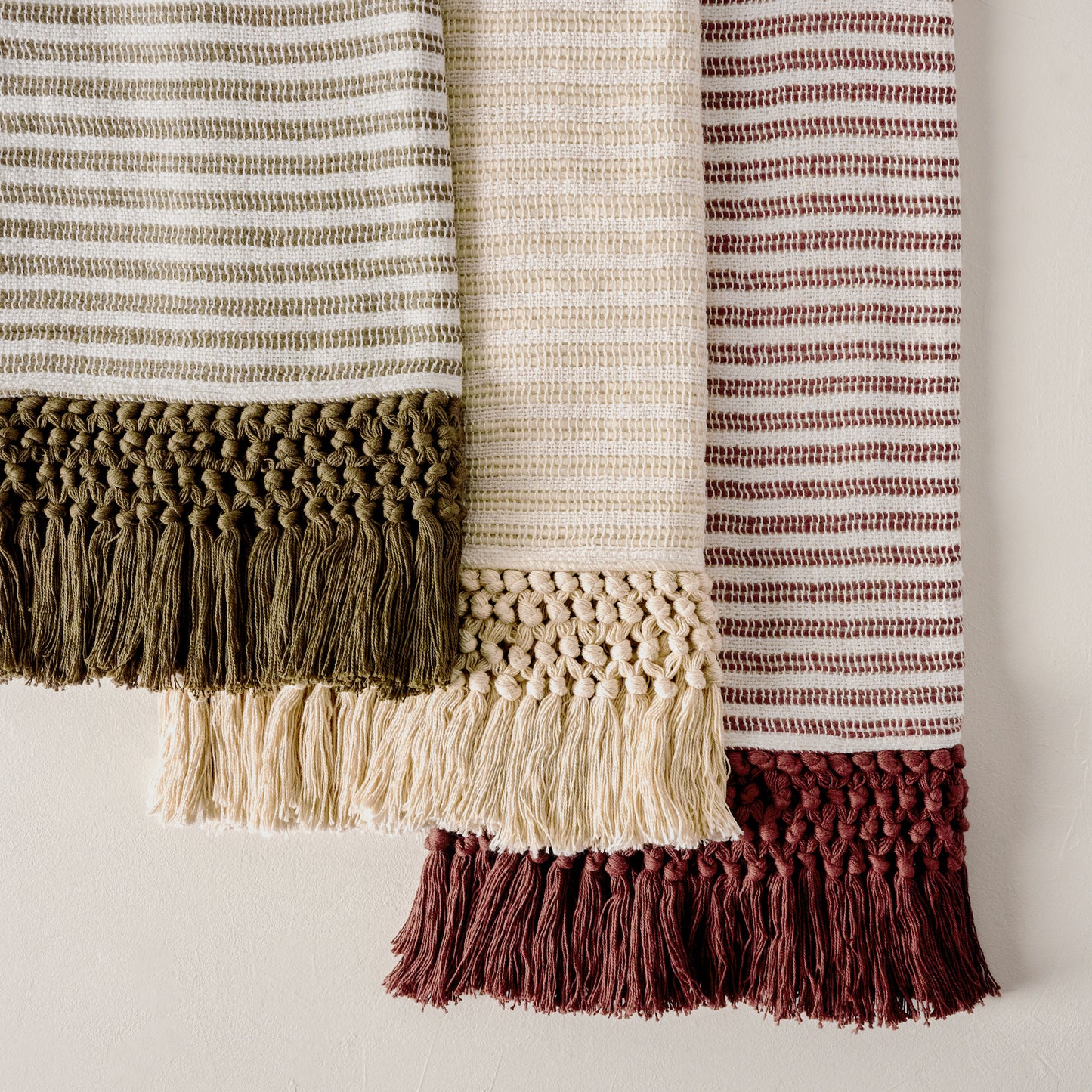 Essential Tassel Throw - Burgundy Striped shown with cream and green throws