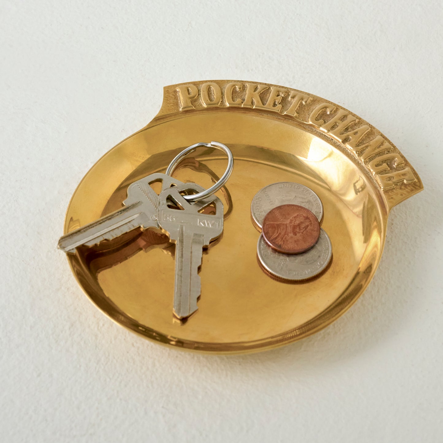 Vintage Inspired Brass Pocket Change Tray shown with keys and coins