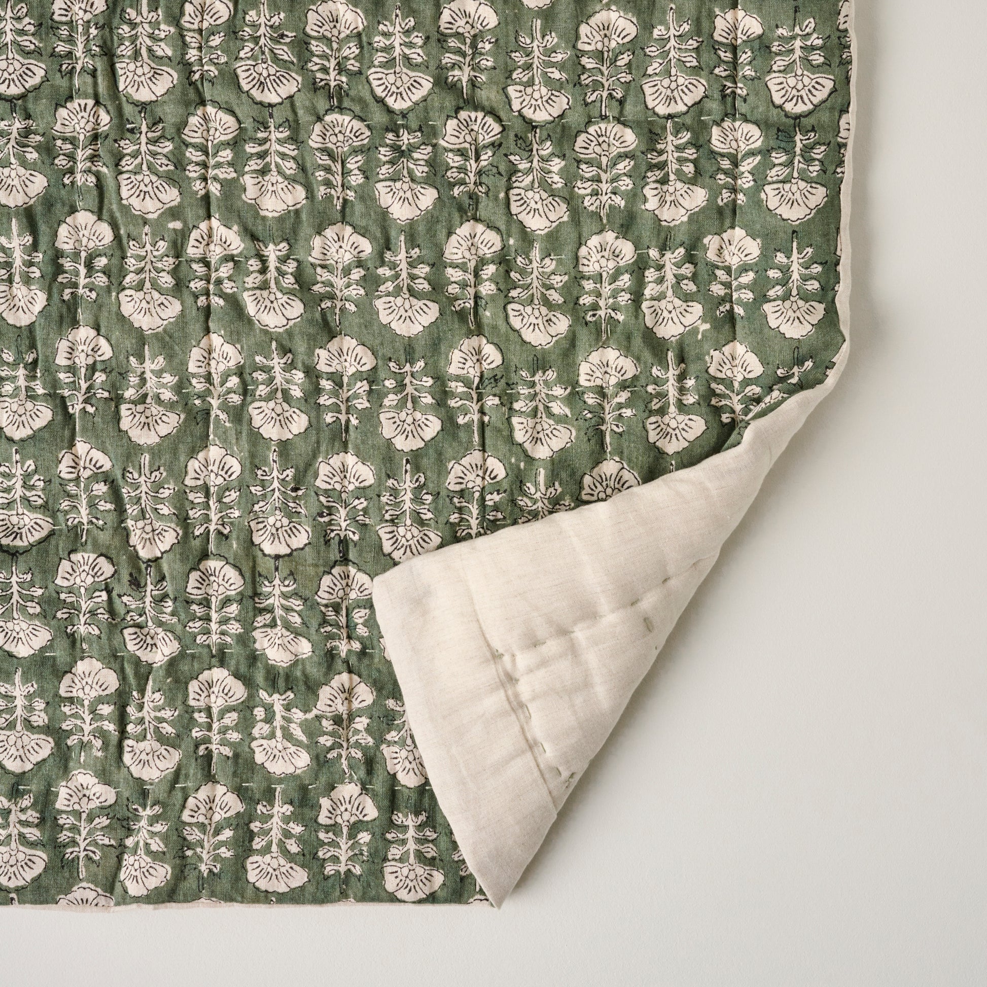 Flora Block Print Quilt - Dusty Green corner shown turned back