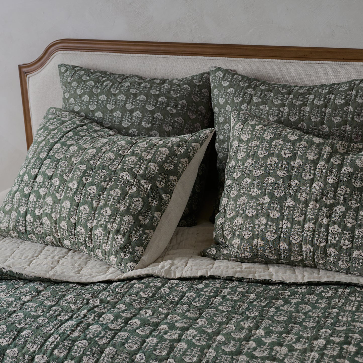 Flora Block Print Pillow Sham - Dusty Green shown on bed