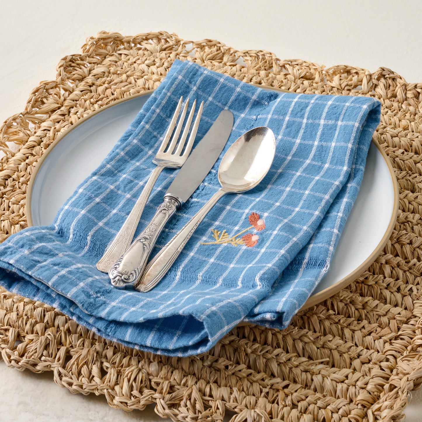 Marigold Embroidered Napkin Set of Four shown with place setting