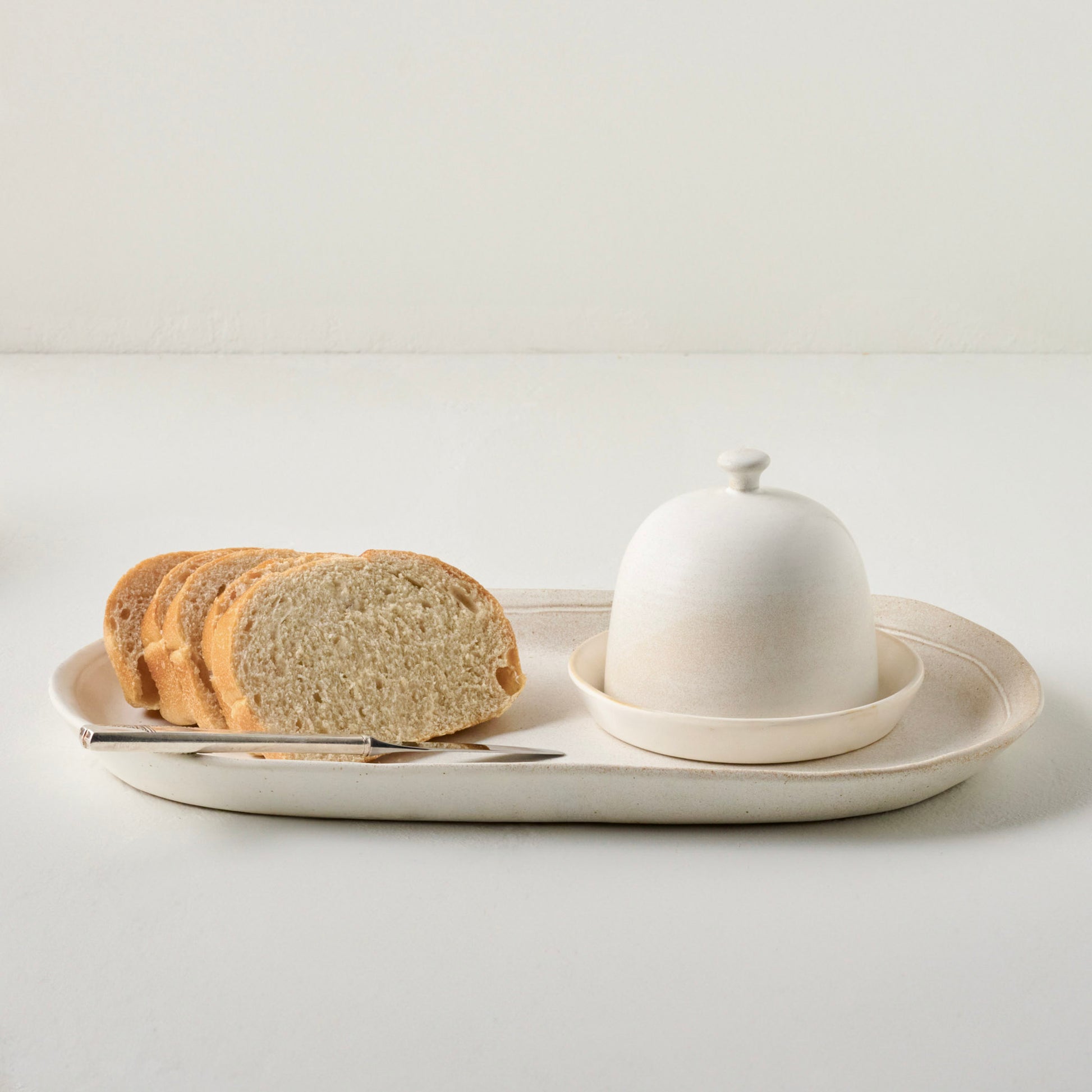 French White Serving Tray shown with bread