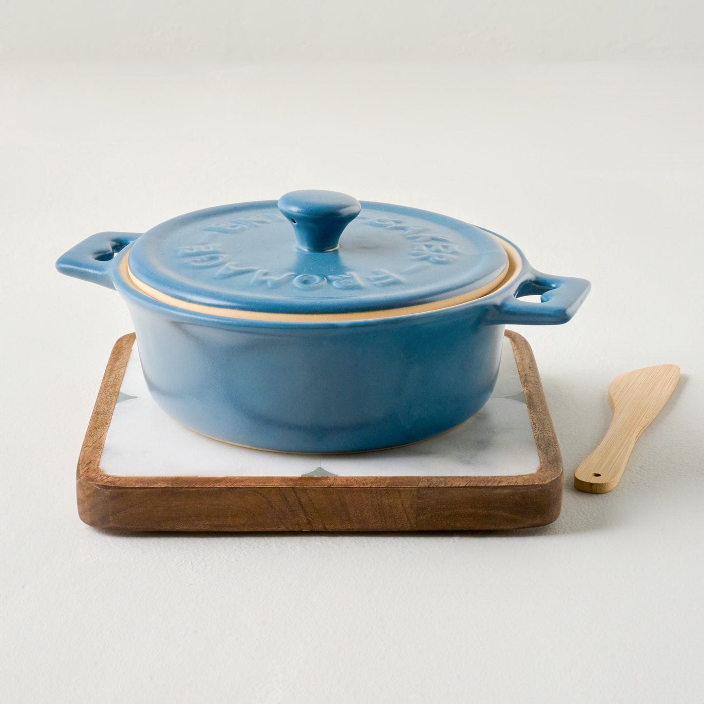 Maribel Stoneware Brie Baker shown on trivet