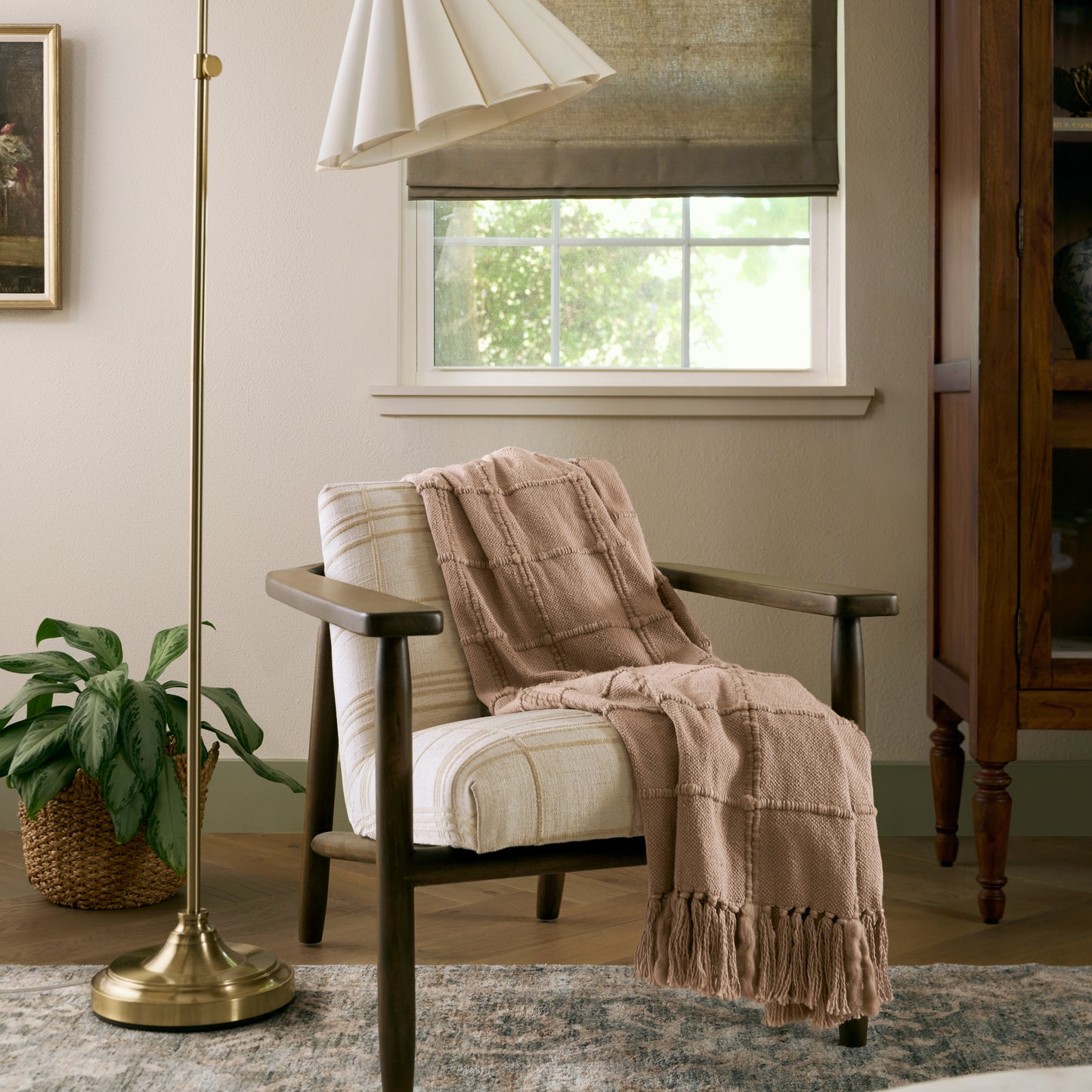 Oatmeal Windowpane Tassel Throw shown draped over chair