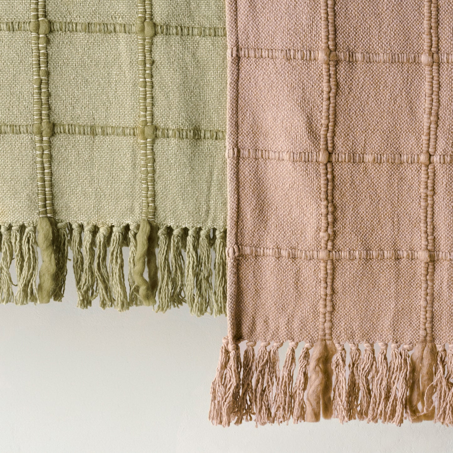 Oatmeal Windowpane Tassel Throw shown with green throw