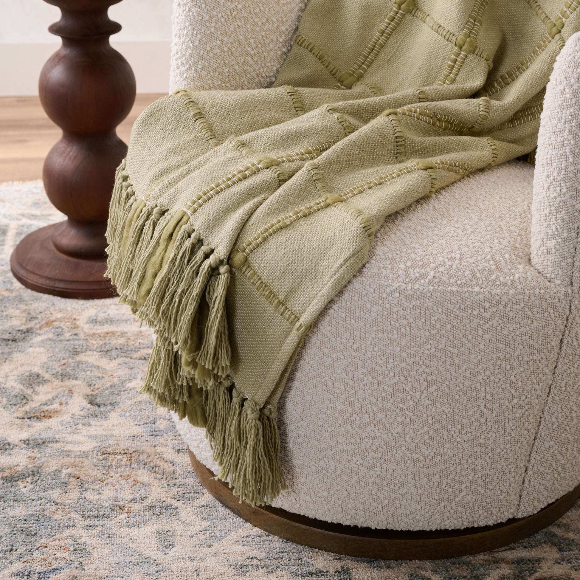 Silver Fern Windowpane Tassel Throw shown draped over chair