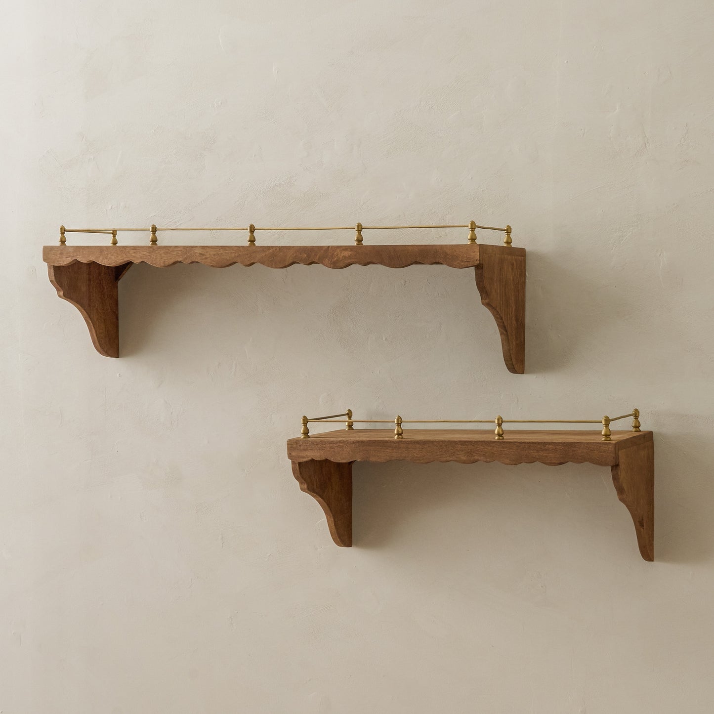 Small and LArge Quinn Wood and Brass Railing Shelf shown hung on wall