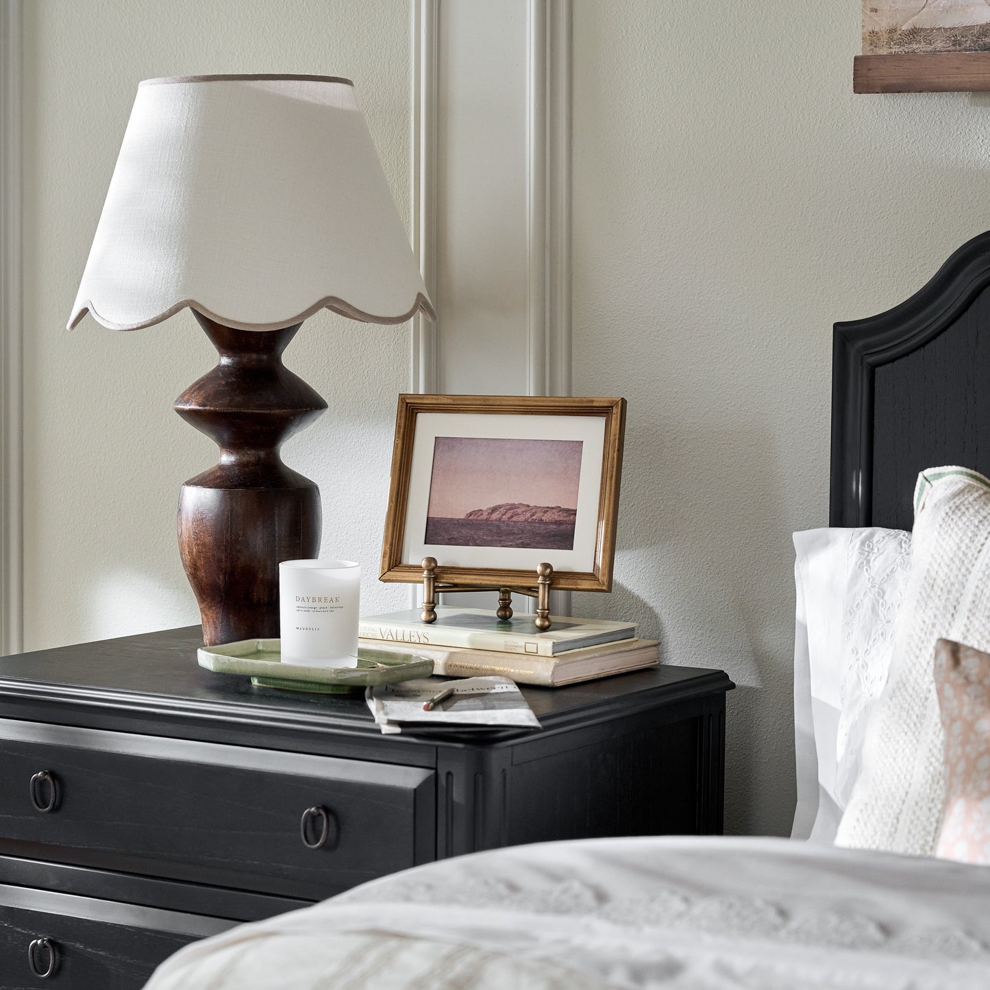 Arthur Antiqued Brass Photo Easel shown styled on nightstand