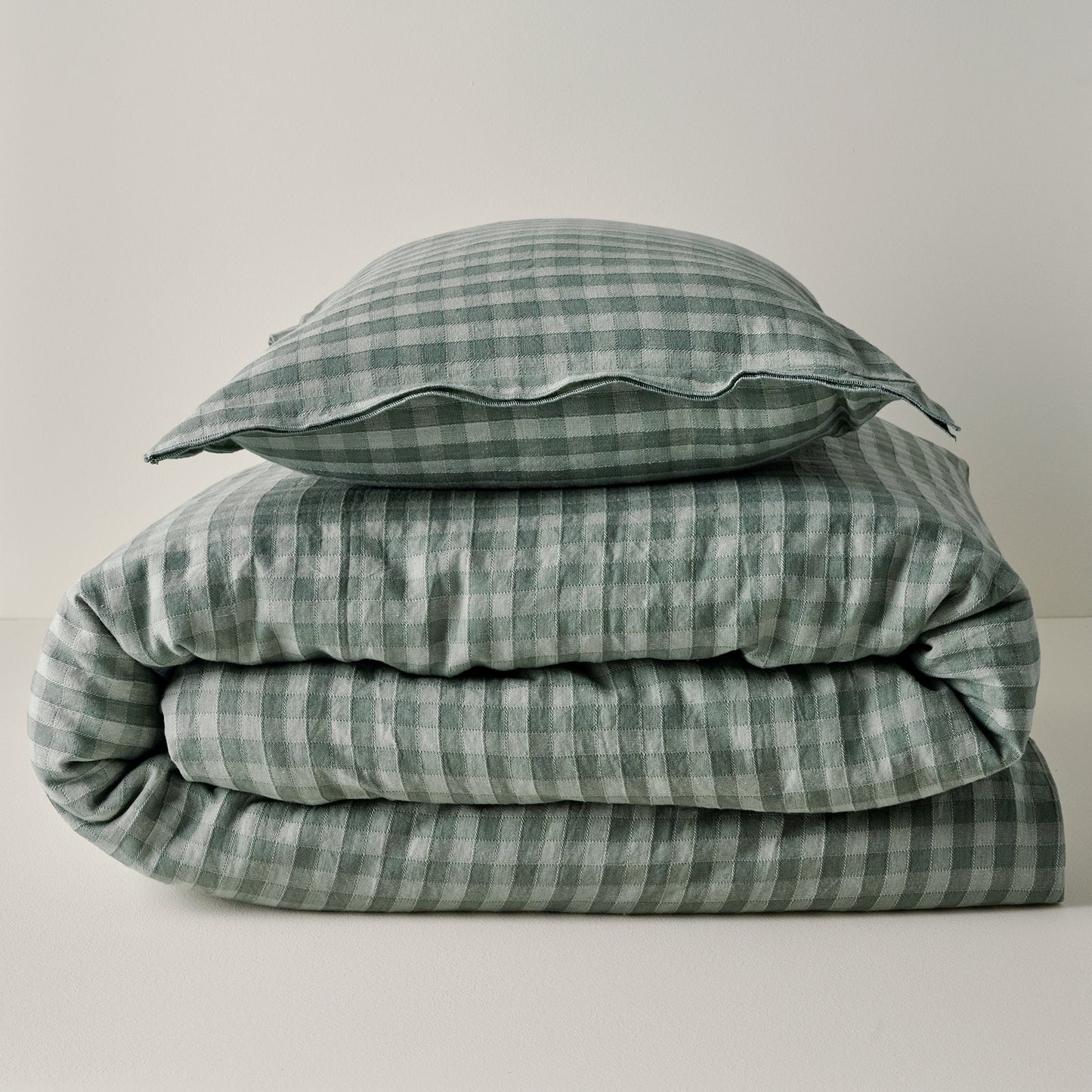 Maxine Gingham Duvet Cover in dusty green shown with coordinating sham