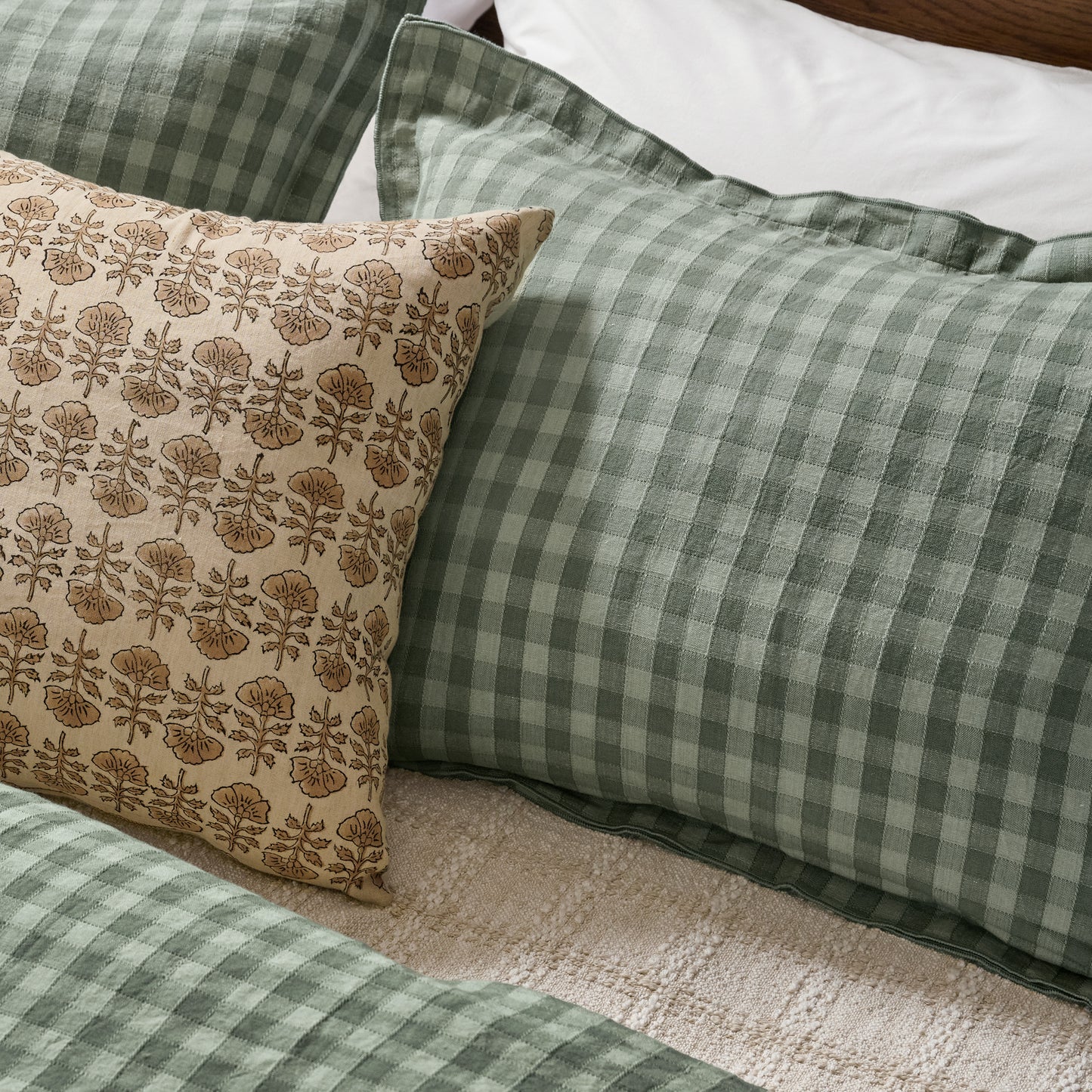 Maxine Gingham Duvet Cover in dusty green shown on bed with coordinating shams