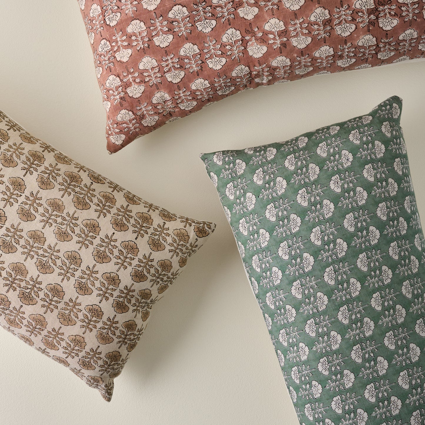 Flora Dusty Green Large Lumbar Pillow shown with other Flora printed lumbar pillows